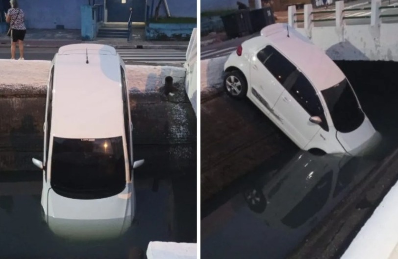 Com o impacto, que ocorreu em um cruzamento, o motorista perdeu o controle e o automóvel caiu no canal