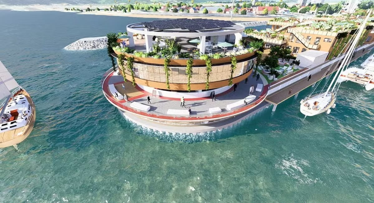 À distância, a estrutura lembra um píer comum, mas, de perto, revela-se um complexo multifuncional com vários pavimentos, áreas amplas e passarelas